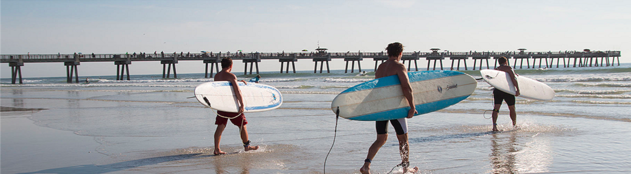 Photo of surfers on the beach in the Jacksonville, Florida area Photo of surfers on the beach in the Jacksonville, Florida area